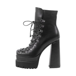 Black platform boot with high heel and lace-up design on a white background