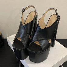 Load image into Gallery viewer, Black platform sandals on a white surface with a neutral background