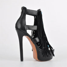 Load image into Gallery viewer, Black high-heeled sandal with fringe details on a white background