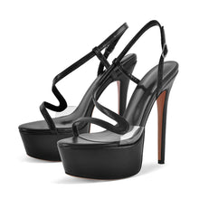 Load image into Gallery viewer, Black high-heeled sandals with clear platform on a white background
