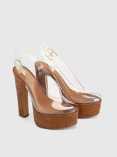 Load image into Gallery viewer, Brown high-heeled shoes with clear straps on a light gray background