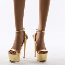 Load image into Gallery viewer, Gold high-heeled sandals on a white background