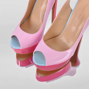 Pink high-heeled shoes with blue soles on a light gray background